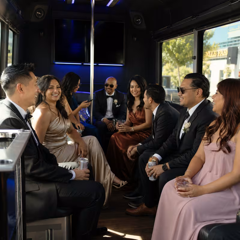 Wedding guests seated inside a Stockton party bus