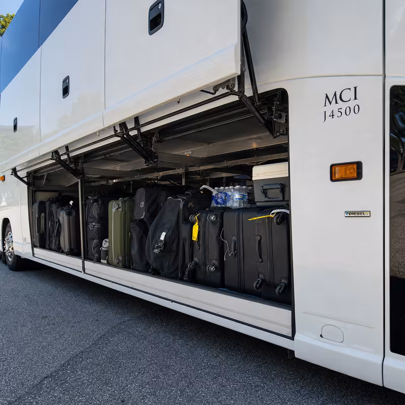 Party bus interior with wraparound leather seating and LED lighting in Stockton