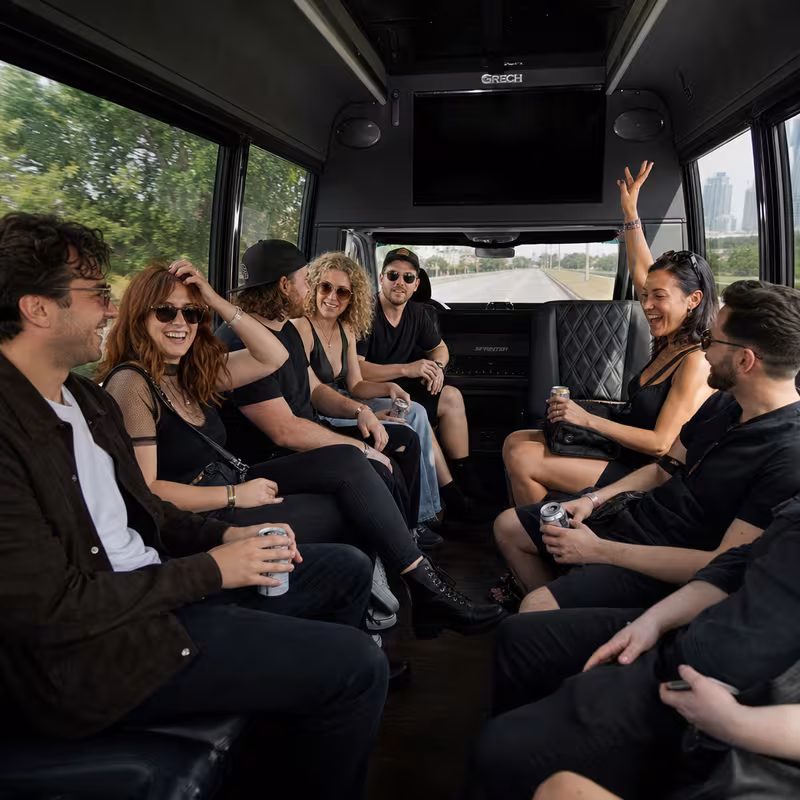 Group boarding a white charter bus for Concert Transportation transportation in Stockton