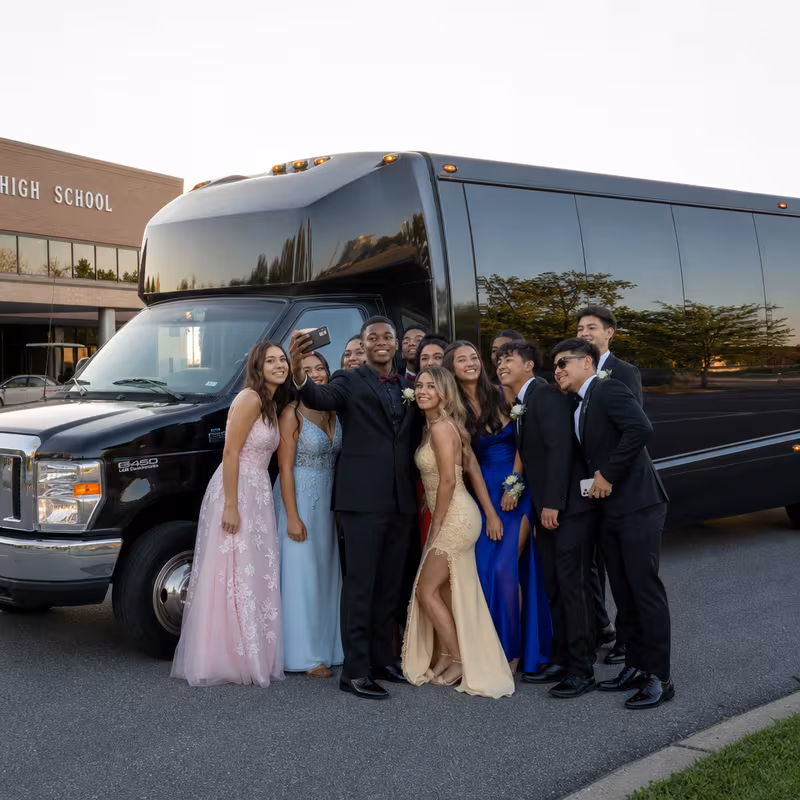 Group boarding a white charter bus for Prom & Homecoming Transportation transportation in Stockton