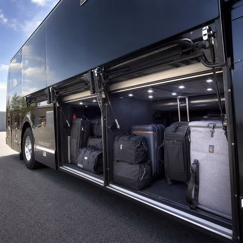 Party bus interior with wraparound leather seating and LED lighting in Stockton