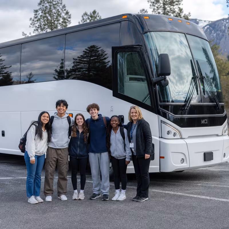 Passengers loading luggage while boarding an Stockton group shuttle