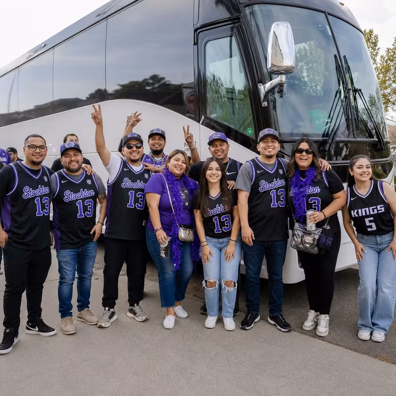 Passengers loading luggage while boarding an Stockton group shuttle