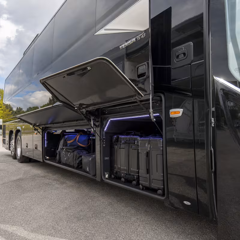 Party bus interior with wraparound leather seating and LED lighting in Stockton