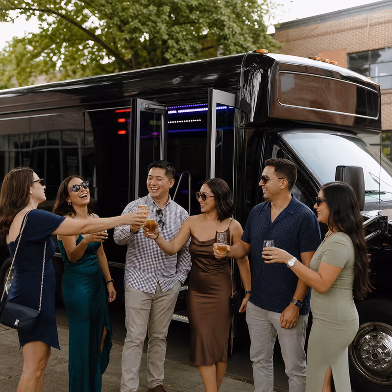 Passengers loading luggage while boarding an Stockton group shuttle